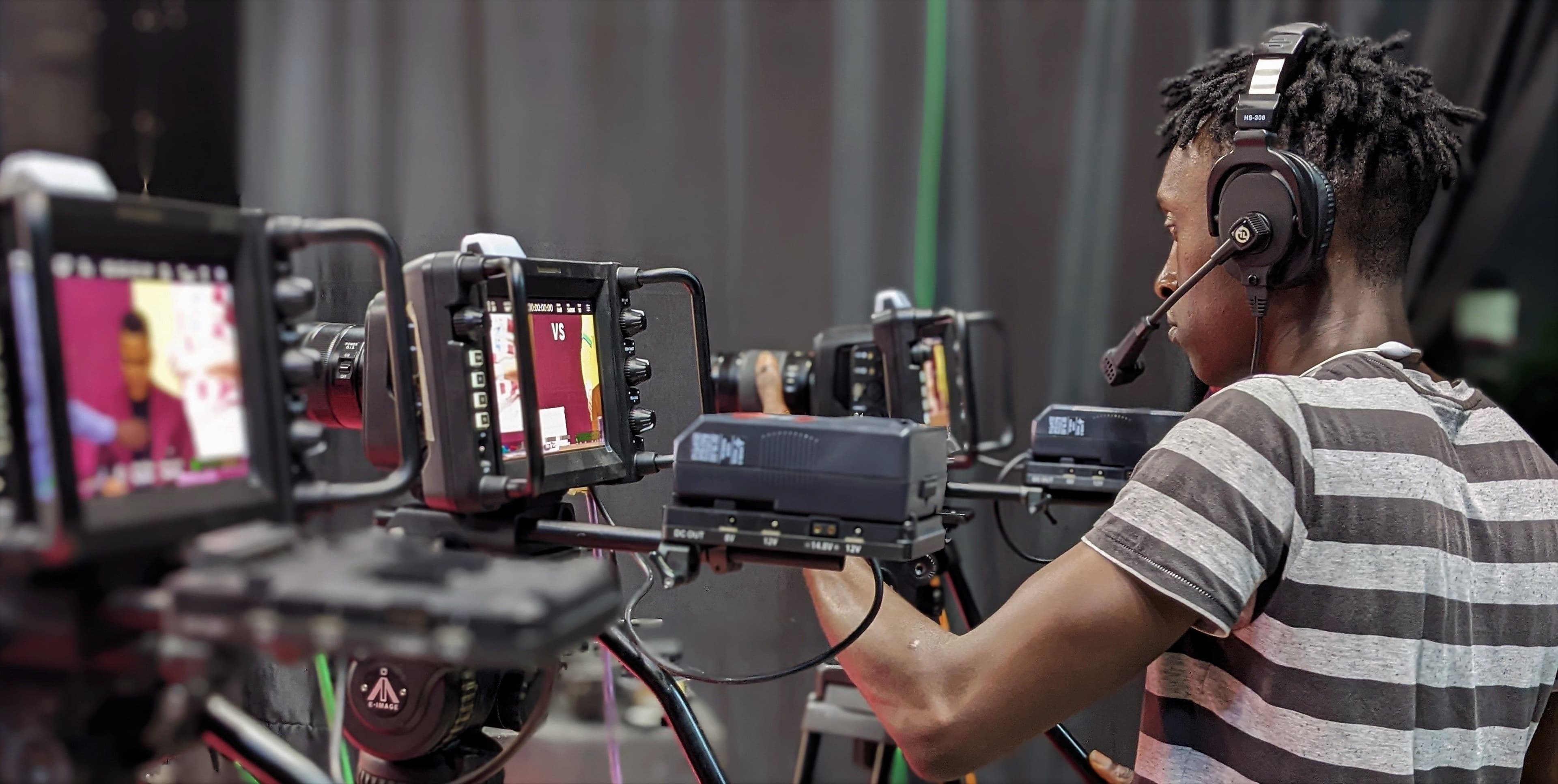 Camera operator working in a television production studio
